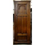 A CARVED OAK HALL ROBE, WITH PANELLED DOOR, 180 X 74CM