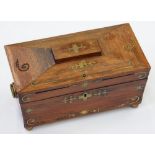 A VICTORIAN BRASS INLAID ROSEWOOD TEA CADDY OF SARCOPHAGUS SHAPE, WITH FITTED INTERIOR, 30CM W