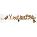 A GOLD CHARM BRACELET, 53G INCLUDING SMALL GOLD PLATED CORNELIAN SET FOB SEAL