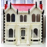 AN EARLY 20TH C TWIN GABLED WOOD DOLLS HOUSE, WHITE AND RED PAINTED WITH BLACK DETAIL, 61CM H AND