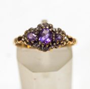 A three stone amethyst 9 carat gold ring, with single cut diamond points, finger size P, 1.