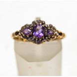 A three stone amethyst 9 carat gold ring, with single cut diamond points, finger size P, 1.