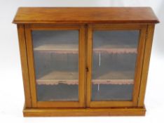 A Victorian mahogany glazed bookcase, with two shelves,