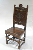 A Victorian oak armchair, partly of 17th century construction,