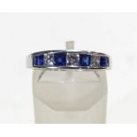 A modern white gold, sapphire and diamond half-eternity ring,