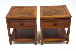 A pair of Chinese hardwood two tier tables, each with a frieze drawer with chained handles, 55.