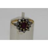 A garnet and diamond cluster ring,