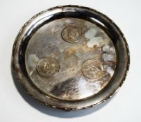 A Chinese coin set salver, stamped 'Wai Kee', Sterling Silver' and 'Made in Hong Kong',