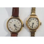 Two lady's 9ct gold cased round wristwatches