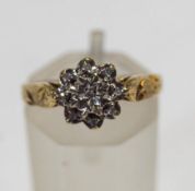 A 9 carat gold diamond cluster ring, with illusion set single cuts, finger size N, 1.