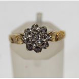 A 9 carat gold diamond cluster ring, with illusion set single cuts, finger size N, 1.