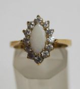 A 9 carat gold opal and cubic zirconia cluster ring, finger size O1/2, 3.