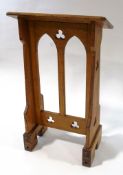 An oak Gothic style lecturn with pierced arches and trefoil detail,