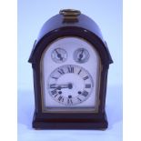 A 20th century mahogany cased mantel clock, the eight day movement playing Westminster Chimes,