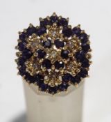 A sapphire and illusion set diamond 9 carat gold cluster ring, finger size N, 6.