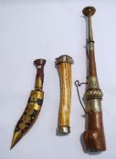 A copper Tibetan trumpet, 41cm long, a smaller bone example, both with white metal mounts,