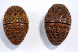 A pair of carved and pierced coquilla nuts,