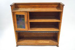 An oak Arts & Crafts style bookcase with stained glass panelled door, 105.