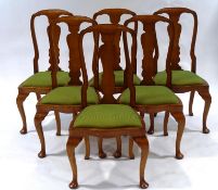 A set of six Queen Anne style beech dining chairs, with cabriole legs and padded drop in seats (NB.