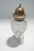 A silver mounted clear cut glass sugar caster, baluster shaped on a square base,