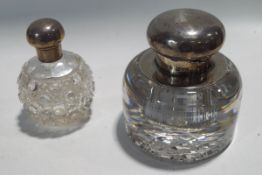 A silver mounted glass inkwell;