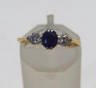 An 18ct gold, sapphire and diamond three stone ring,