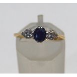 An 18ct gold, sapphire and diamond three stone ring,