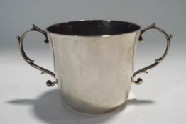 A silver two handled loving cup, retailed by "Tessiers, London", hallmarked London 1961,