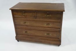 A 20th century oak chest of two short over two long drawers, formerly a dressing table,