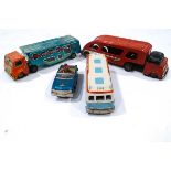 A Trailerway tin plate bus and two tin plate car carriers and a tin plate 'Bump and Go' car