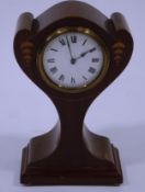 An Edwardian mahogany balloon clock, of Art Nouveau form, with decorative inlay,