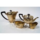 A matched silver four piece tea service, Birmingham 1934, hot water jug 1933,