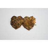 A late Victorian 9 carat gold Mizpah brooch,