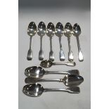 A pair of Georgian silver fiddle pattern table spoons, possibly William Eley and William Fearn,
