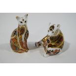 Two Royal Crown Derby paperweights, a seated bear and a cat, gold coloured stoppers,