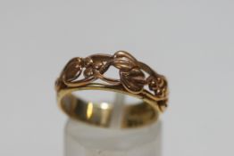 A Clogau Gold 9 carat gold open work fronted ring, finger size O1/2, 4 g gross,