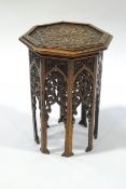A Middle Eastern hexagonal occasional table, wth carved fretwork sides,