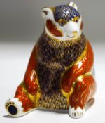 A Royal Crown Derby seated bear paperweight, with gold coloured stopper,