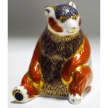 A Royal Crown Derby seated bear paperweight, with gold coloured stopper,