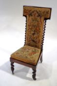 A Victorian rosewood pre-dieu chair, with tapestry upholstery,