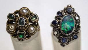 An emerald and simulated pearl ring; another set with an opal and sapphires,