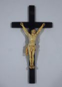A 19th Century Continental carved ivory figure of Christ on an ebonised cross,
