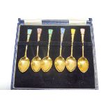 A set of six silver gilt and polychrome enamel coffee spoons, Birmingham 1963, by Turner & Siimpson,