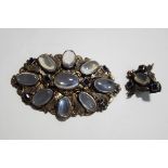 A moonstone and blue paste set oval brooch, possibly Austro Hungarian,