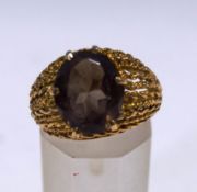 A smokey quartz single stone dress ring, stamped '9ct', finger size N, 4.