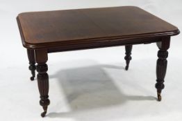 A late Victorian mahogany wind out dining table,
