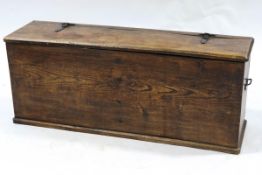 A narrow oak chest, with interior division, iron carrying handles and hinges,