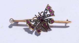 A late Victorian rose diamond and ruby butterfly bar brooch,
