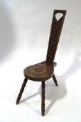 A Welsh oak spinners chair, with carved sunflower and fauna design,