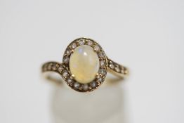 A 9 carat gold opal and synthetic stone cluster ring, finger size R1/2, 2.